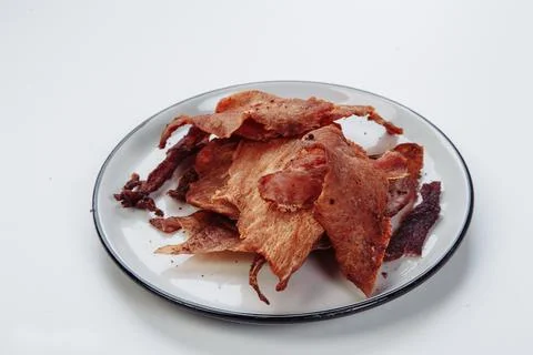 Cured meat full frame meat close-up. small, thin pieces cut into Stock Photos