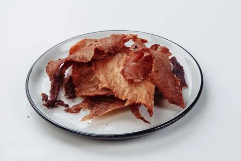 Cured meat full frame meat close-up. small, thin pieces cut into Stock Photos