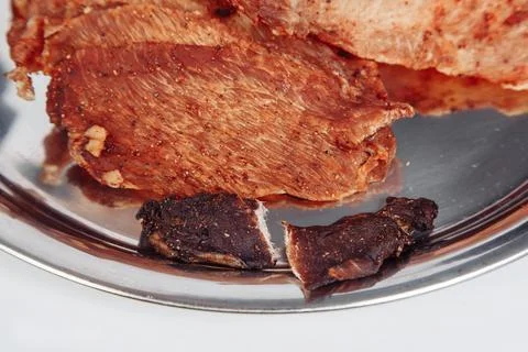 Cured meat full frame meat close-up. small, thin pieces cut into Stock Photos