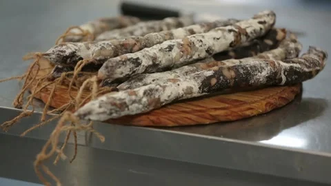 Cured sausage with mold on a board Stock Footage 146649279