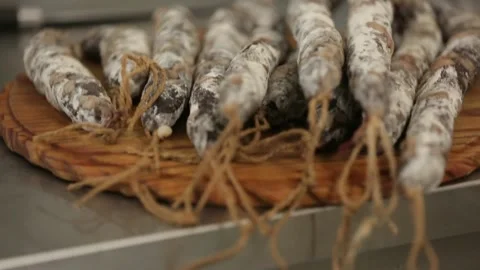 Cured sausage with mold on a board Stock Footage 146649302