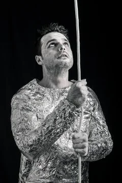 Curious alien with rope looking up Stock Photos