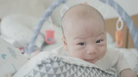 Curious Baby Exploring Playmat Textures Stock Footage 313831139