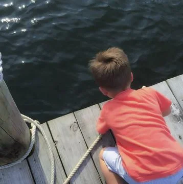 Curious Child by the Dock Stock Photos