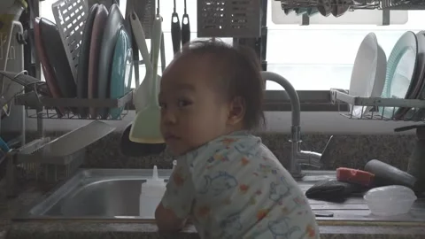 Curious Child in Kitchen at Sink Stock Footage 345662685