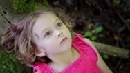 Curious Child Looks Up Into The Trees In Wonder (Shot From Above) Stock Footage