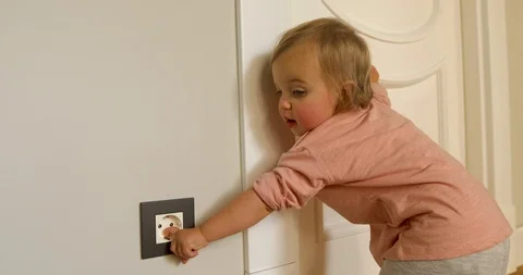 Curious child playing with electric plug 動画素材 116092880