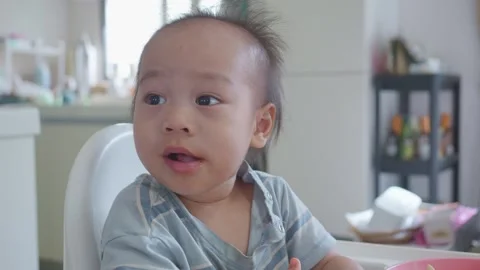 Curious Child at Table Watching Food 스톡 동영상 341142852