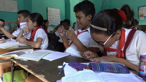 Curious elementary school students at work in classroom Trinidad, Cuba Stock Footage 78569874