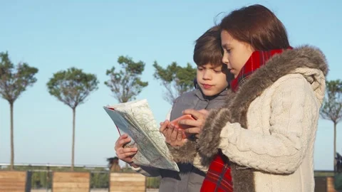 Curious kids exploring the internet for exciting tourist spots Stock Footage 311989395