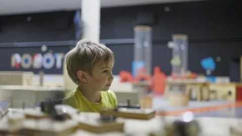Curious little boy exploring an interactive science museum Stock Footage 317819739