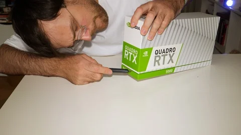 Curious man unboxing unpacking Nvidia Quadro RTX 5000 Stock Footage 118368929