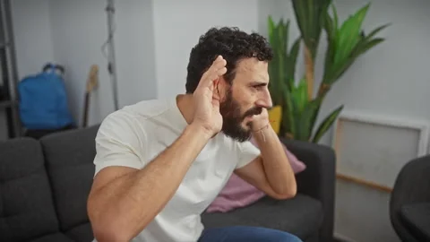 Curious middle-aged man with hearing problem, trying to hear juicy gossip i.. Stock Footage 279372913