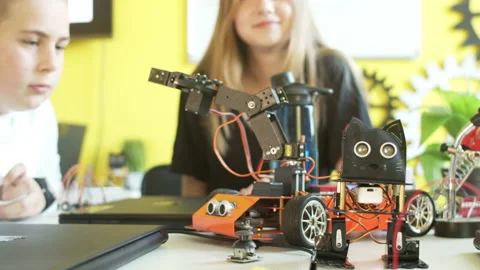 Curious smiling students in modern robotics class Stock Footage 140751554