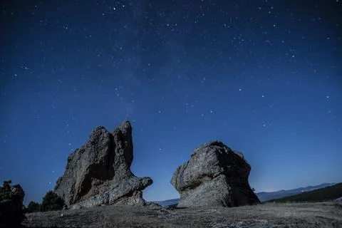 Curious stone formations under the night stars Stock Photos
