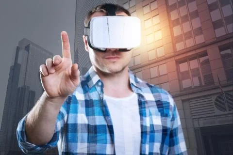 Curious student trying new virtual reality glasses Foto stock