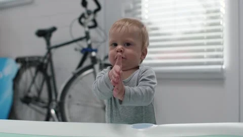 Curious Toddler Claps Hands Stock Footage 294100806