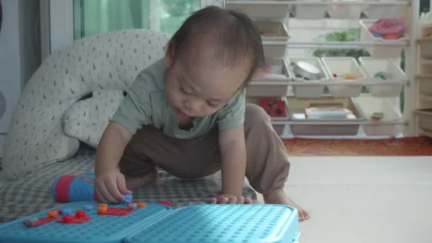 Curious Toddler Exploring Colorful Building Blocks Video stock 344032088
