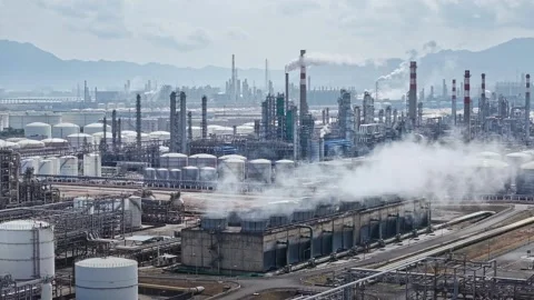 Curling fire and cumin smoke filling the sky. Smoking chimneys from the factory 動画素材 324874286