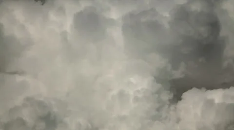 Curling puffy clouds of sunlit lumpy steam. Meditative view of white pure vapor. Stock Footage 38615993