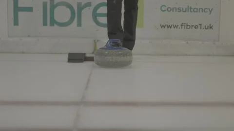 Curling stone front on tracking to camera Video stock 163945980