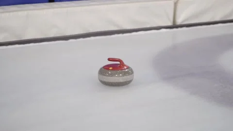 The Curling stone slides on the ice. Video stock 134929370