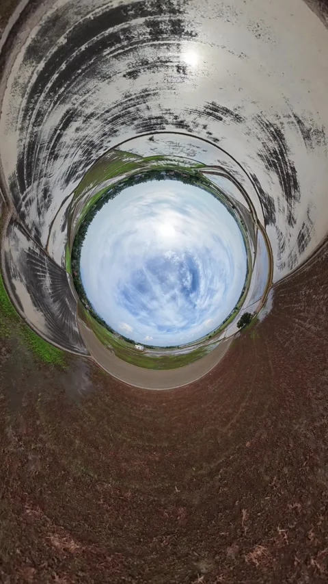 Curling tunnel leads to bright, open sky above Stock Footage 345408178