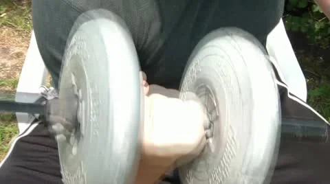 Curling Weights in Sun Stock Footage 12576924