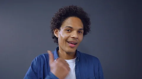 Curly Afro-american Guy Showing Thumb Up on Studio Background. Stock Footage 109173660