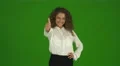 The curly businesswoman thumb up and stand on the green background. Real time 4k or 4k+ Resolution