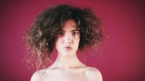 Curly girl posing at the camera Stock Footage 81699624