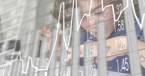 Curly-haired boy tapping keys at study desk, generating line graph and bar Stock Footage 318626632
