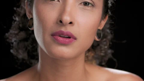 Curly-haired latina model strokes shoulder off-shoulder look Stock Footage 341122822