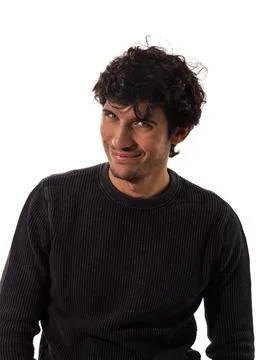 Curly-Haired Man smiling to camera Stock Photos