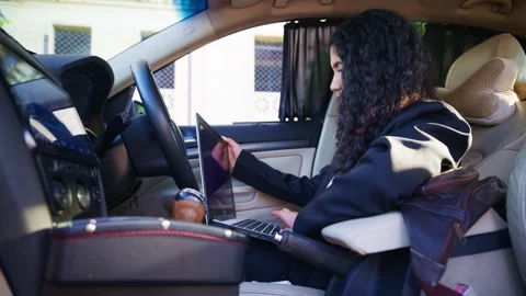 Curly Haired Professional Engross with Job from Sedan Stock Footage 313669054