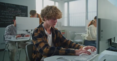 Curly Haired Young Man Working on Game Development Project Stock Footage 318518170