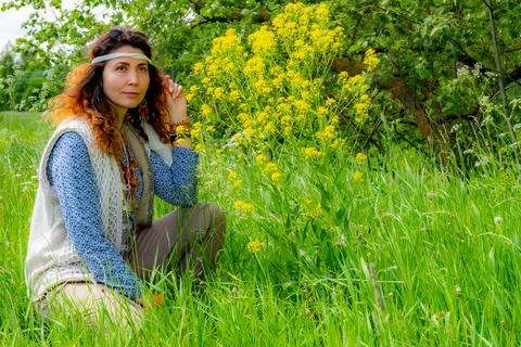 Curly hippie in a clearing Foto stock