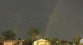 Curly lightning and a double rainbow HD-videomateriaal