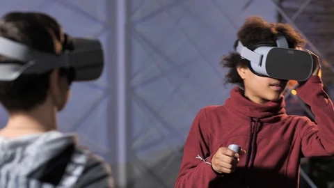 Curly mixed race boy getting used to VR glasses Stock Footage 124934840