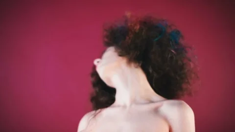 Curly model twists his head Stock Footage 81699461