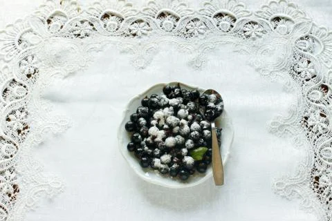 Currant berries are covered with powdered sugar Stock Photos