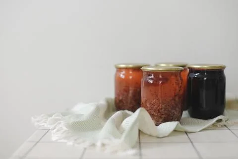 Currant jam in jar on a light background in rustic style Stock Photos