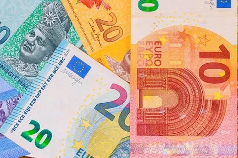 Currency banknotes of different values with Malaysian ringgit, Euro cash many Stock Photos