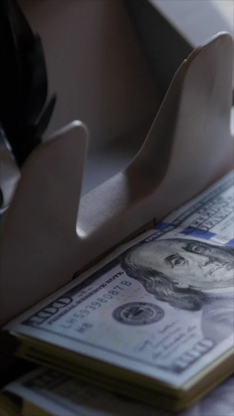 Currency Counter Machine. A Stack Of Hundred-Dollar Bills. Vertical. Stock Footage 283991443