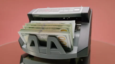 Currency Counter Processing Hundred Dollar Bills on Pink Stock Footage 335018960