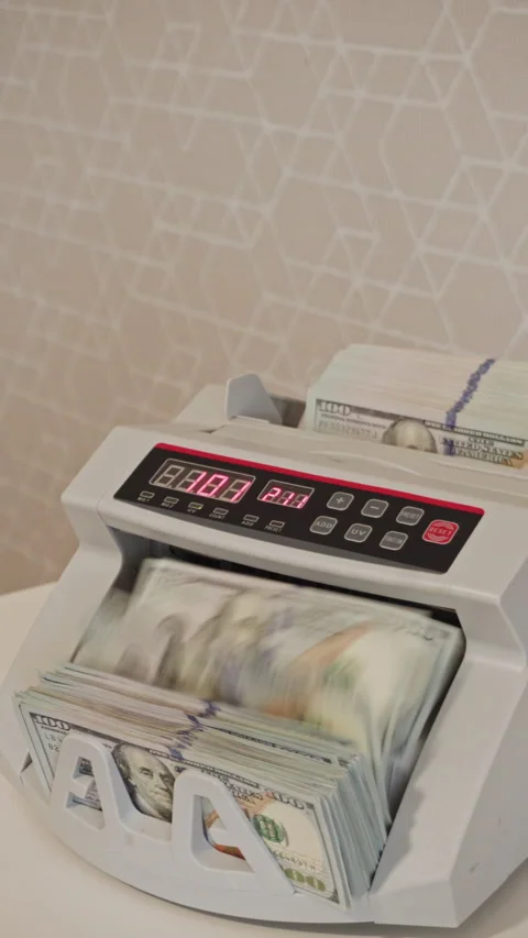 Currency counting machine in action at a financial office Stock Footage 298892730