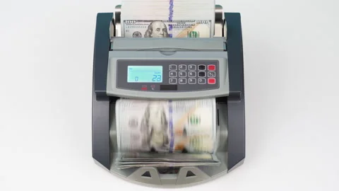 Currency counting money machine counts 100 dollars bills or USD banknotes. Cash Stock Footage 148574334