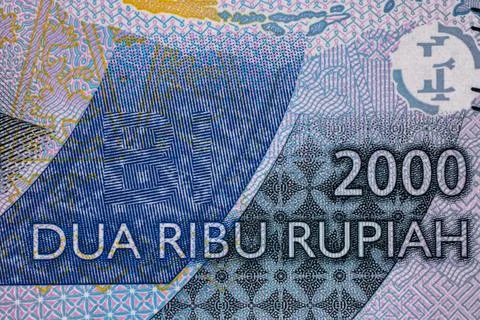 Currency with design elements from different countries on display 库存照片