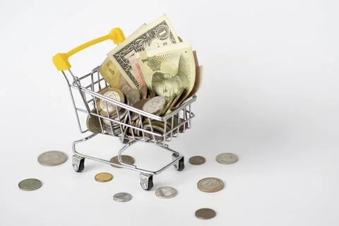 Currency of different countries. On a white background, a cart full of money, Stock Photos
