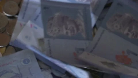 Currency Notes Falling into a Pile.  SloMo. Malaysia. Finance Concept Stock Footage 260152102